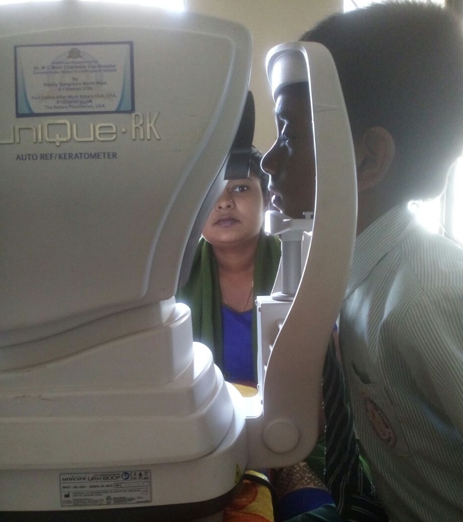 A child receiving an eye screening